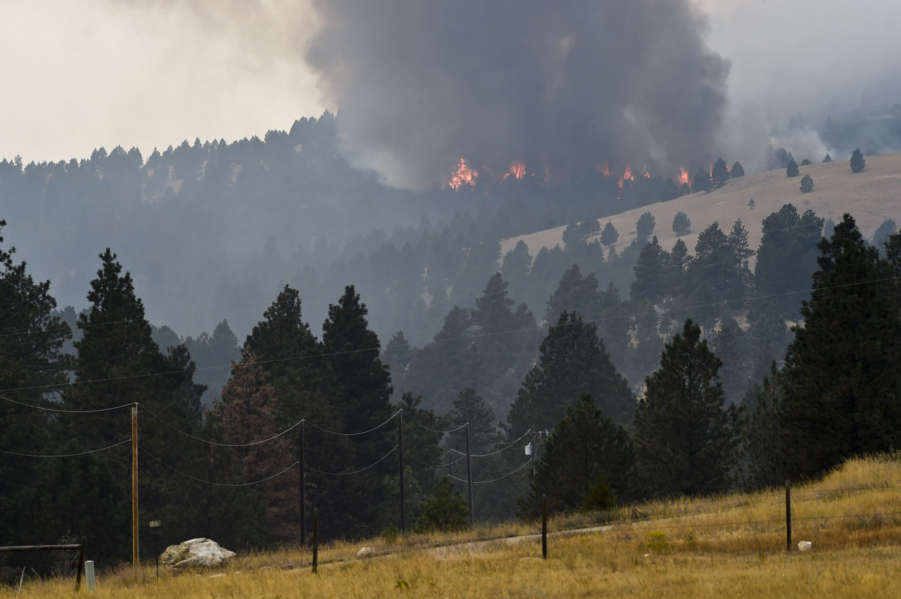 Roughly one hundred personnel and multiple aircraft help battle a lightening caused fire south of Helena Thursday afternoon.